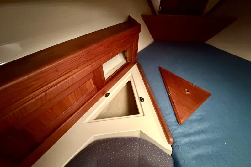 Slide: The Image of Interior cabin of 1997 Pacific Seacraft Crealock 37 with wooden storage compartment. - 72