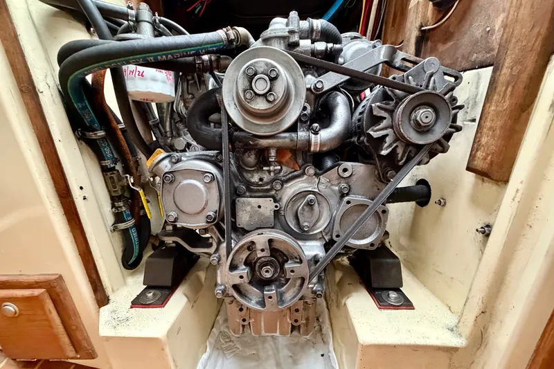 Slide: The Image of Engine of a 1997 Pacific Seacraft Crealock 37 sailboat, showcasing mechanical components. - 40