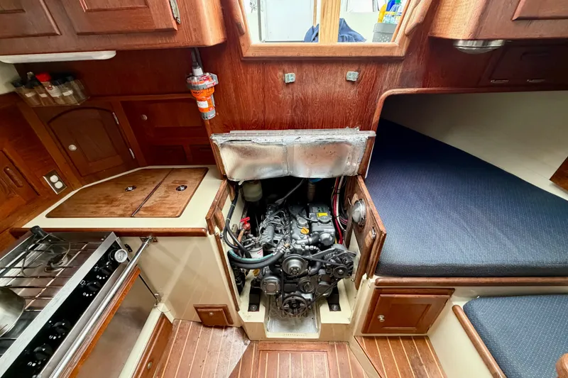 Slide: The Image of Interior of a 1997 Pacific Seacraft Crealock 37 sailboat showing engine and galley area. - 39