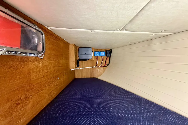 Slide: The Image of Interior of 1997 Pacific Seacraft Crealock 37 sailboat with electrical panel and wood finish. - 46