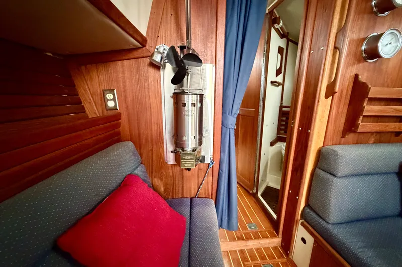 Slide: The Image of Interior of 1997 Pacific Seacraft Crealock 37 sailboat with wood paneling and cozy seating. - 51