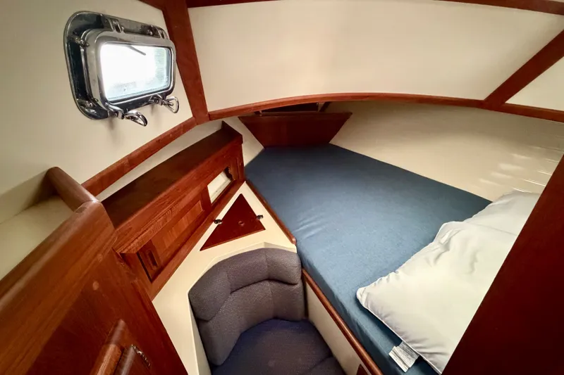 Slide: The Image of Cozy cabin interior of 1997 Pacific Seacraft Crealock 37 sailboat with wooden accents. - 67