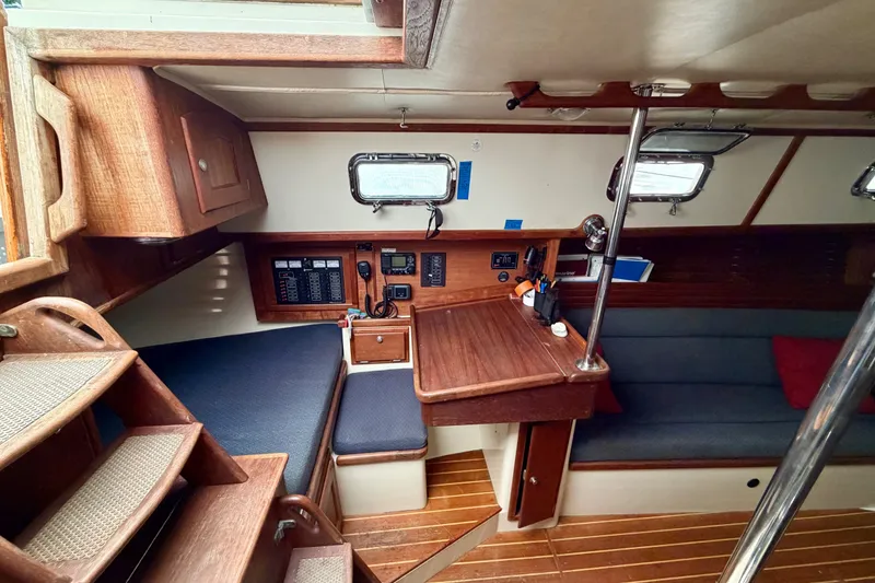 Slide: The Image of Interior of 1997 Pacific Seacraft Crealock 37 sailboat with wooden cabinetry and seating. - 14