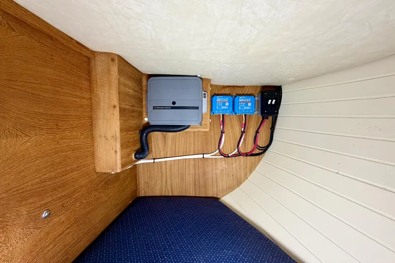 Slide: The Image of Electrical panel setup in a 1997 Pacific Seacraft Crealock 37 sailboat interior. - 47