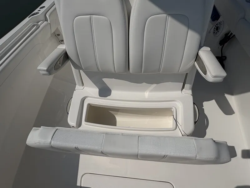 Slide: The Image of The 2025 Regulator 25 features a sleek, cushioned bench seat with integrated storage. - 37