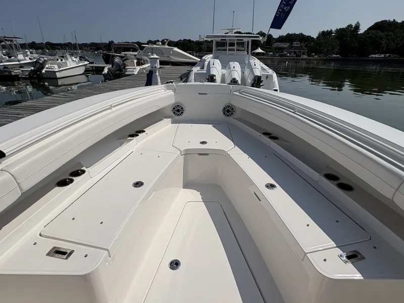 Slide: The Image of The image shows the spacious bow area of a 2025 Regulator 25 boat docked at a marina. - 38