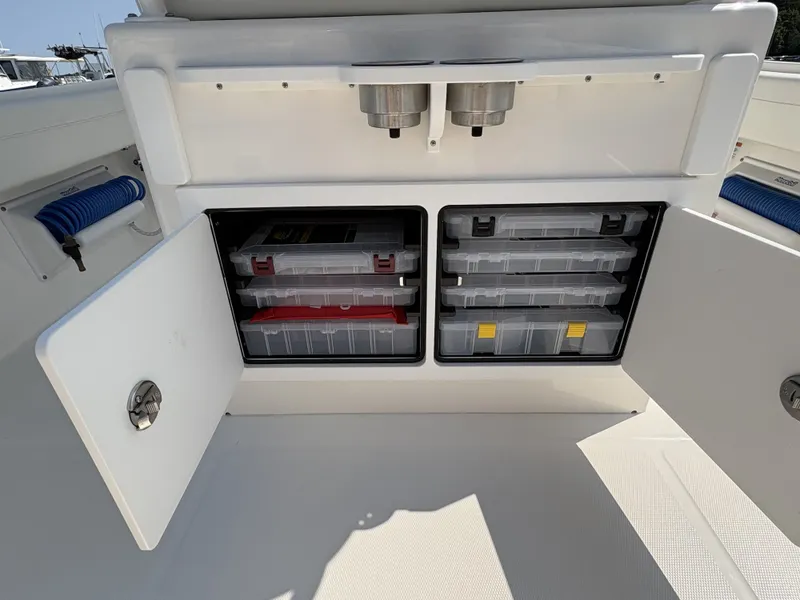 Slide: The Image of The image shows a storage area on a boat with multiple compartments and drawers. - 21