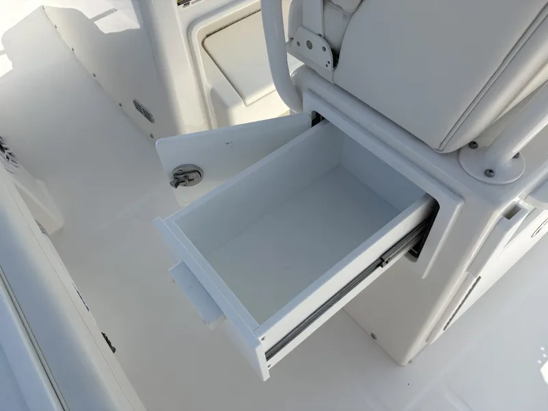 Slide: The Image of An open white storage compartment on a boat with a clean, modern design. - 22