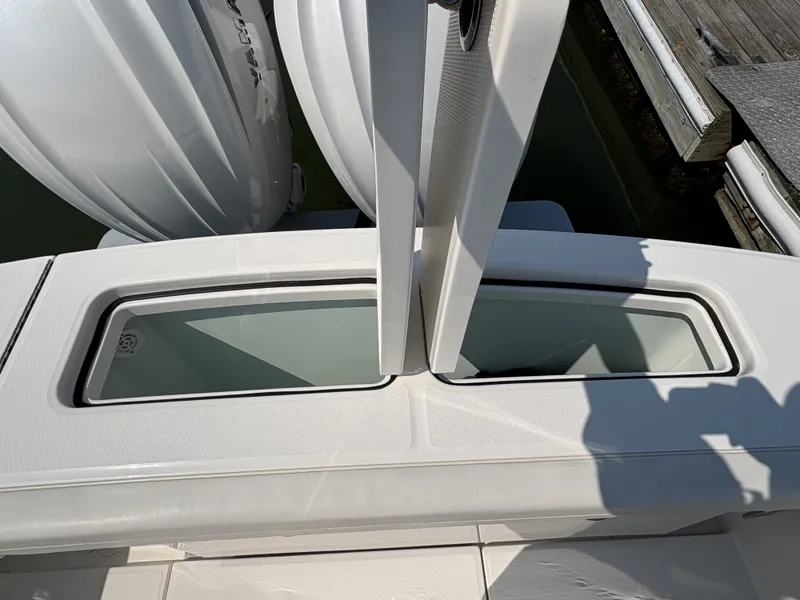 Slide: The Image of A modern boat with two large outboard engines and a glass window in the stern area. - 15