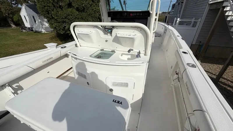 Slide: The Image of The image shows the cockpit of a 2007 Everglades 290 CC boat with helm console and seating area. - 7