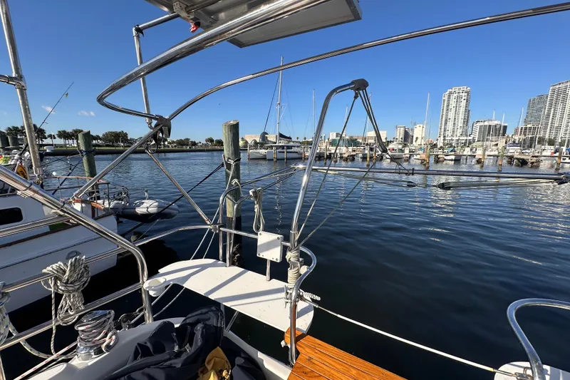 Slide: The Image of Hunter 41 Deck Salon 2007 yacht docked in a marina with city skyline. - 36