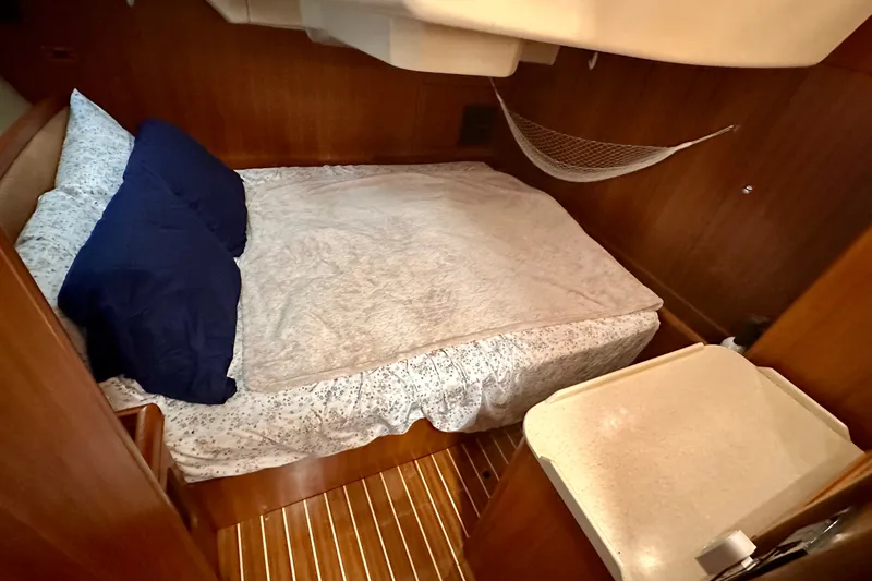 Slide: The Image of Cozy cabin interior of 2007 Hunter 41 Deck Salon with bed and wooden finish. - 7