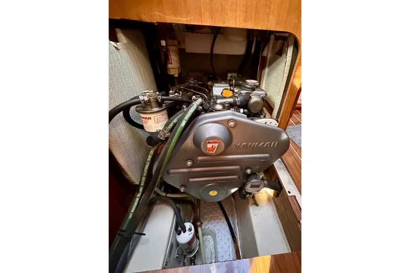 Slide: The Image of Engine compartment of 2007 Hunter 41 Deck Salon sailboat, featuring Yanmar engine. - 18