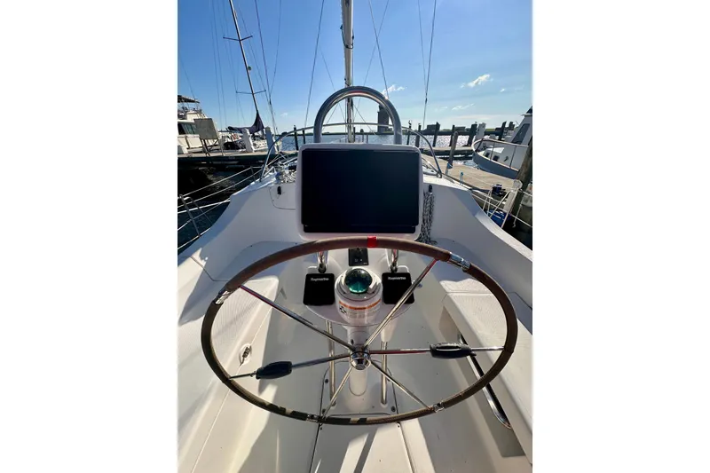 Slide: The Image of 2007 Hunter 41 Deck Salon yacht cockpit with steering wheel and navigation equipment. - 38