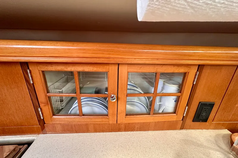 Slide: The Image of Wooden cabinet with glass doors on a 2007 Hunter 41 Deck Salon yacht. - 11