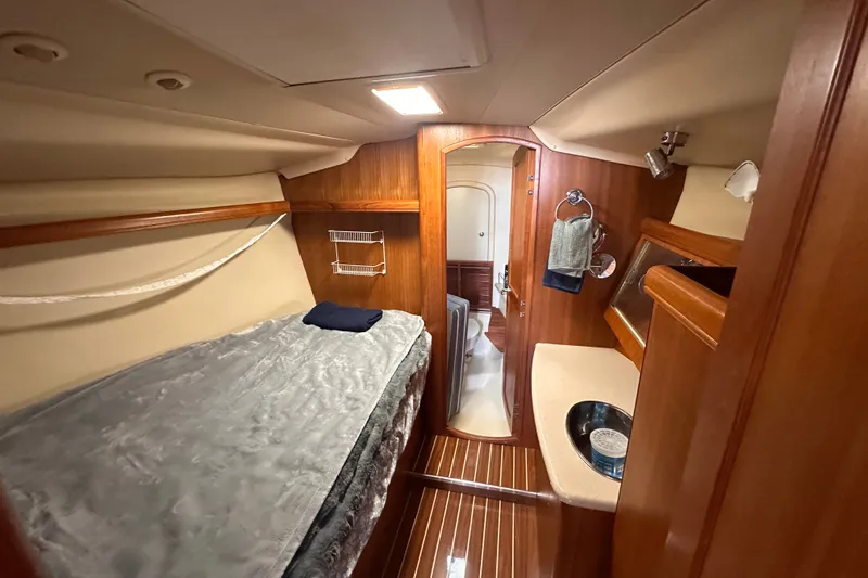 Slide: The Image of Interior of 2007 Hunter 41 Deck Salon yacht with cozy cabin and wooden finishes. - 8