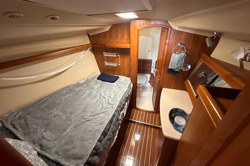 Slide: The Image of Interior of 2007 Hunter 41 Deck Salon yacht with cozy cabin and bathroom. - 34