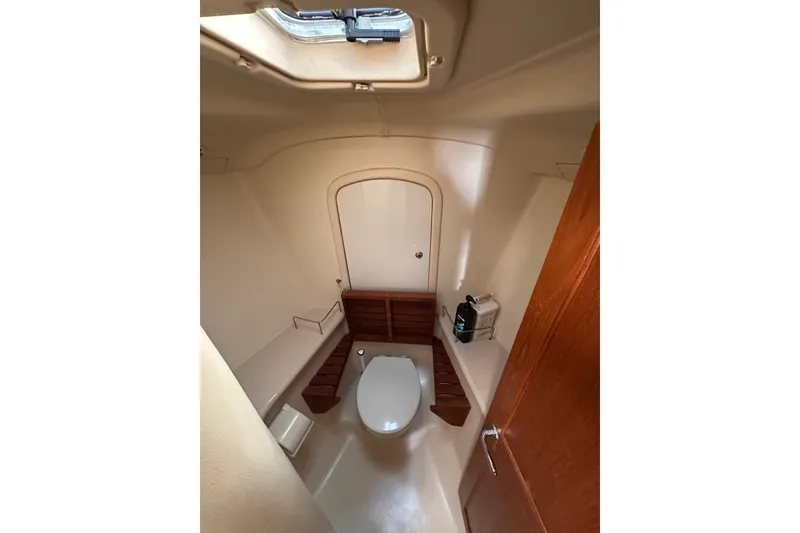 Slide: The Image of Bathroom interior of 2007 Hunter 41 Deck Salon yacht, featuring a compact design. - 13