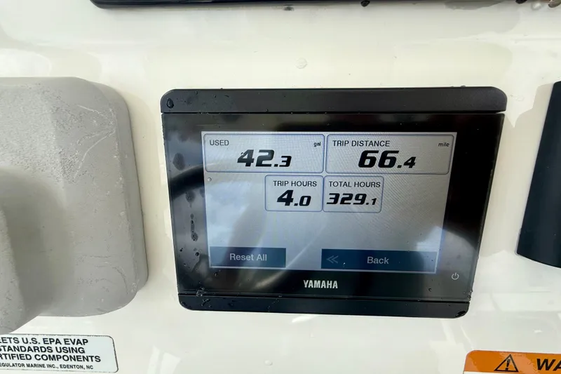 Slide: The Image of Yamaha display showing fuel usage and trip data on 2021 Regulator 24XO boat. - 16