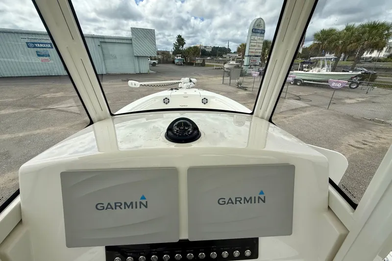Slide: The Image of Interior view of 2021 Regulator 24XO boat with Garmin navigation displays. - 15