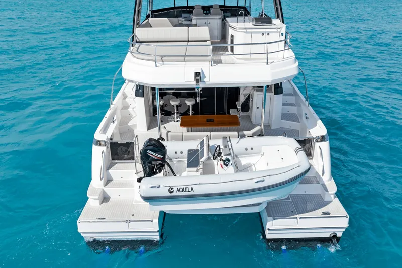 Slide: The Image of The 2027 Aquila 50 features a modern design with a spacious deck and luxurious interior. - 12