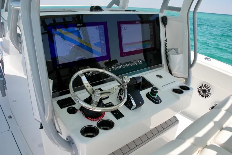 Slide: The Image of 2024 Freeman 38 boat dashboard with advanced navigation and control systems. - 11
