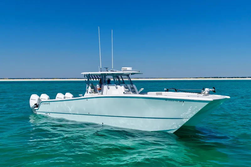 Slide: The Image of 2024 Freeman 38 boat cruising on clear blue water under a sunny sky. - 2