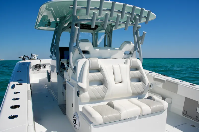 Slide: The Image of 2024 Freeman 38 boat interior with luxurious seating and ocean backdrop. - 18