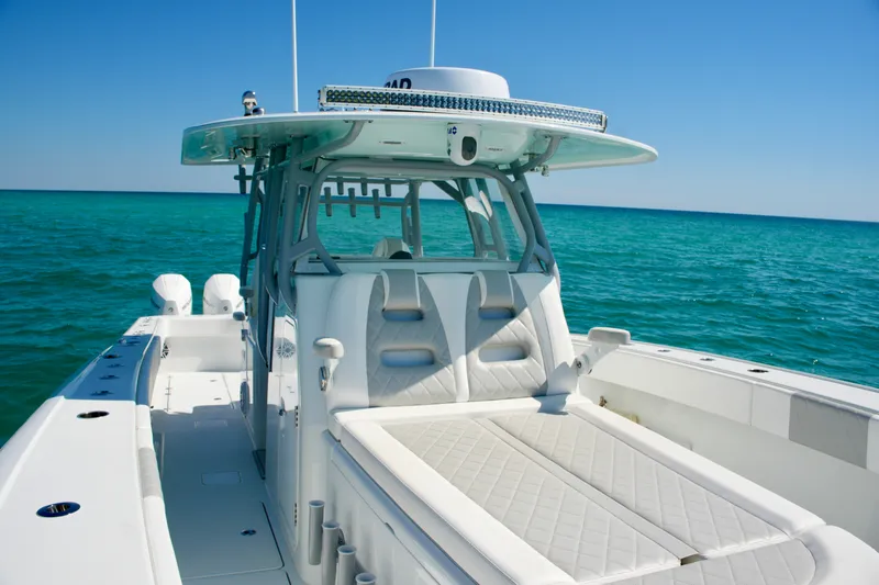 Slide: The Image of 2024 Freeman 38 boat on clear blue ocean, showcasing sleek design and spacious deck. - 30