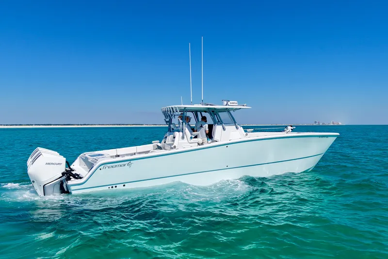 Slide: The Image of 2024 Freeman 38 boat cruising on clear blue ocean waters. - 8