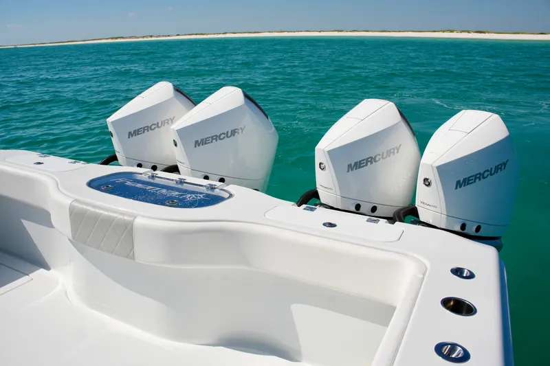 Slide: The Image of Freeman 38 boat with four Mercury outboard engines on turquoise water, 2024 model. - 24