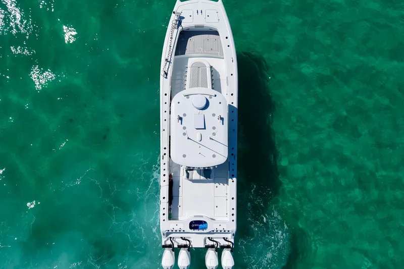 Slide: The Image of Top view of 2024 Freeman 38 boat on clear turquoise water. - 9