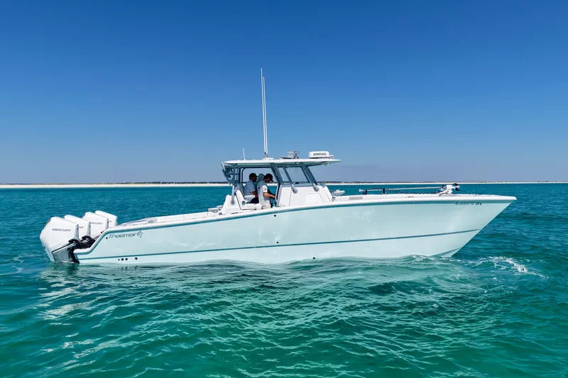 The Image of 2024 Freeman 38 boat cruising on clear blue water under a bright sky. - 1