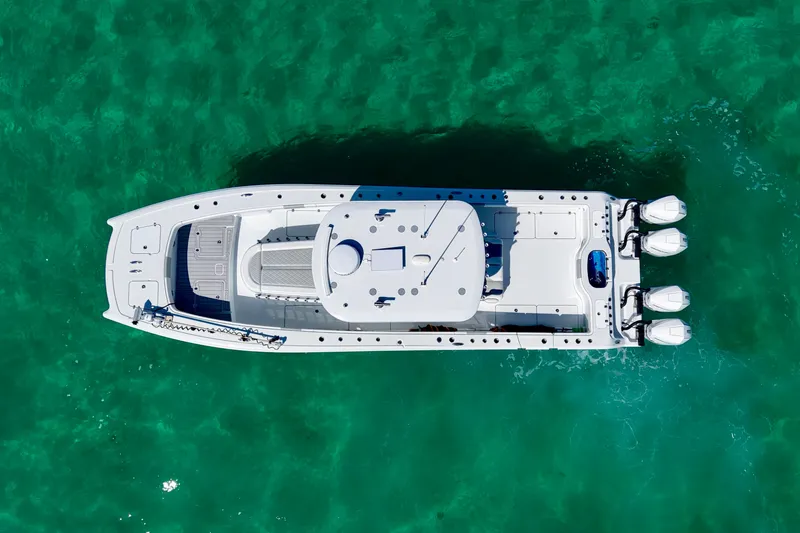 Slide: The Image of Aerial view of 2024 Freeman 38 boat on turquoise water. - 10