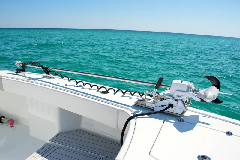 Slide: The Image of 2024 Freeman 38 boat with trolling motor on turquoise ocean waters. - 34