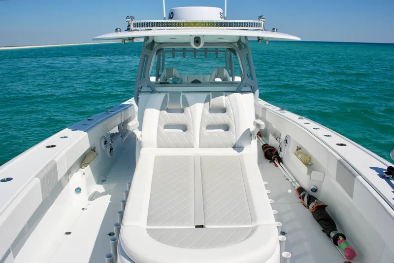 Slide: The Image of 2024 Freeman 38 boat with luxurious seating on turquoise ocean waters. - 31