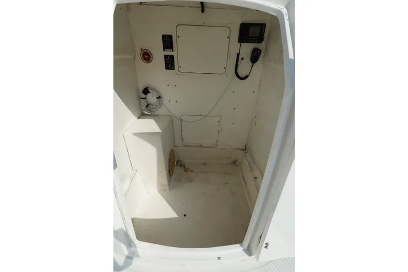 Slide: The Image of Interior of 2021 Cortez 31 Super Panga boat, featuring control panel and storage space. - 17