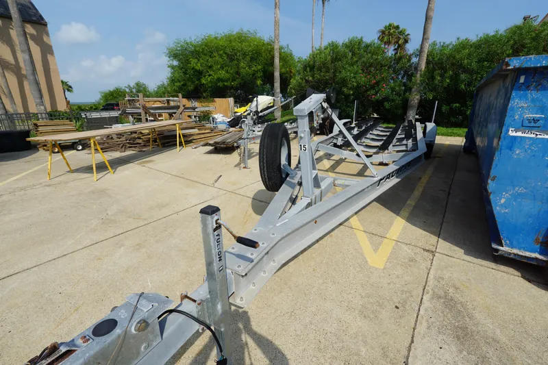 Slide: The Image of Boat trailer for 2021 Cortez 31 Super Panga in outdoor storage area. - 27
