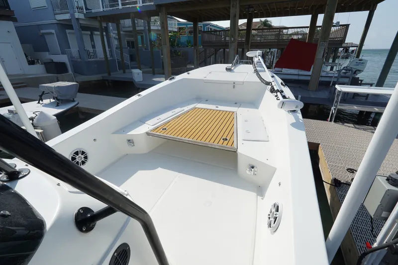 Slide: The Image of 2021 Cortez 31 Super Panga boat docked, featuring spacious deck and modern design. - 22