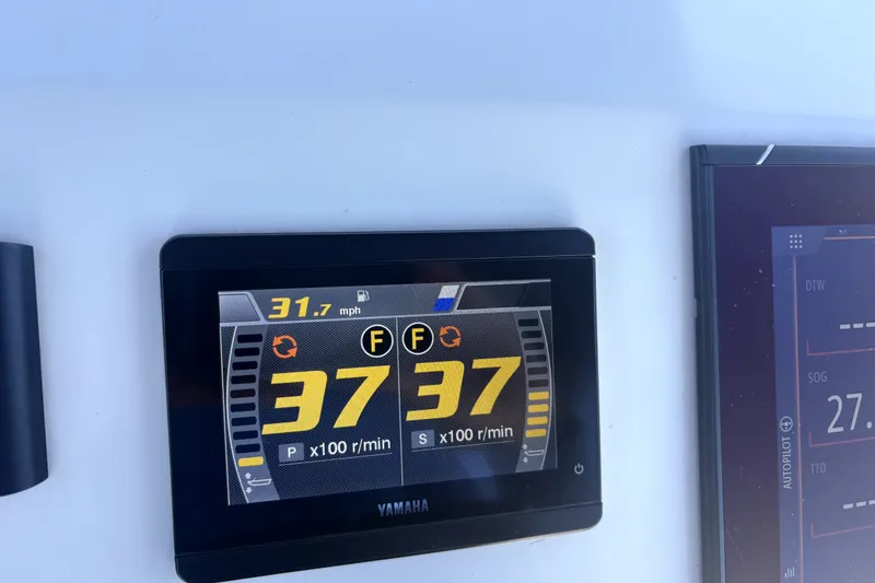 Slide: The Image of Yamaha display showing 31.7 mph speed on Cortez 31 Super Panga, 2021 model. - 30