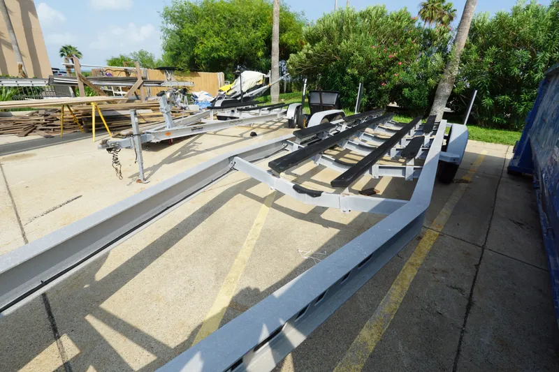 Slide: The Image of Boat trailer for 2021 Cortez 31 Super Panga, parked outdoors on concrete. - 28