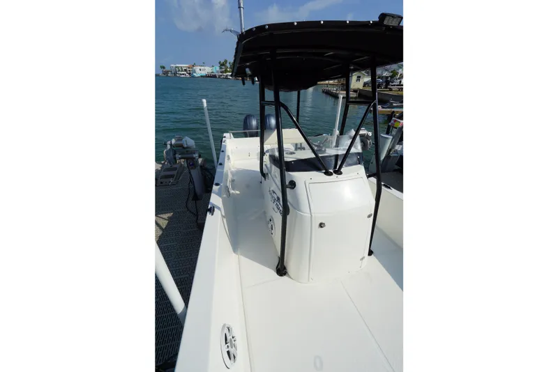 Slide: The Image of 2021 Cortez 31 Super Panga boat docked, showcasing sleek design and spacious deck. - 19
