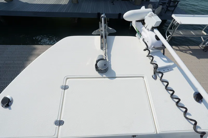 Slide: The Image of Bow deck of 2021 Cortez 31 Super Panga with anchor and trolling motor. - 4