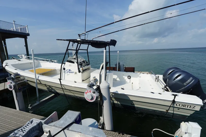 The Image of 2021 Cortez 31 Super Panga boat docked by the ocean with dual Yamaha engines. - 0