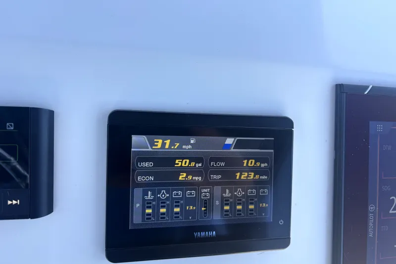Slide: The Image of Yamaha display on Cortez 31 Super Panga, showing speed, fuel usage, and trip data. - 31