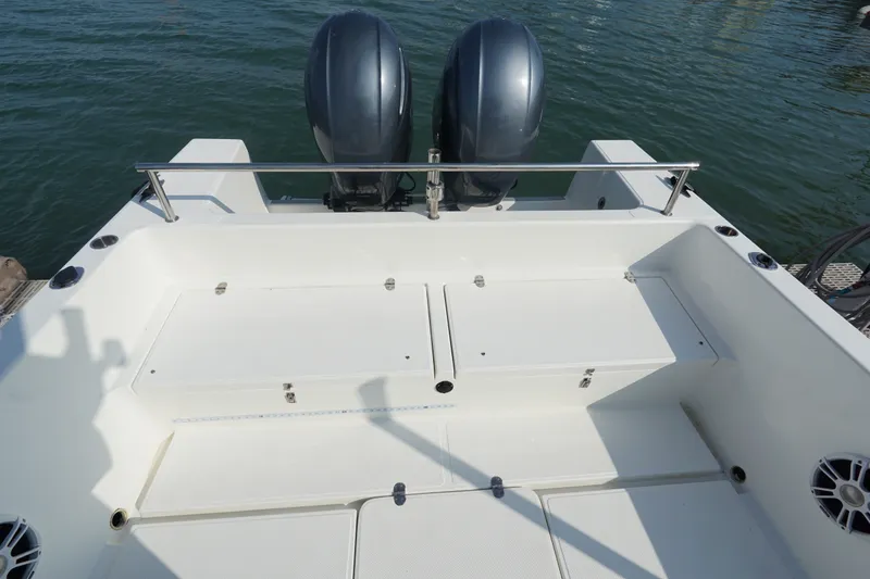 Slide: The Image of 2021 Cortez 31 Super Panga boat deck with dual outboard motors on water. - 9