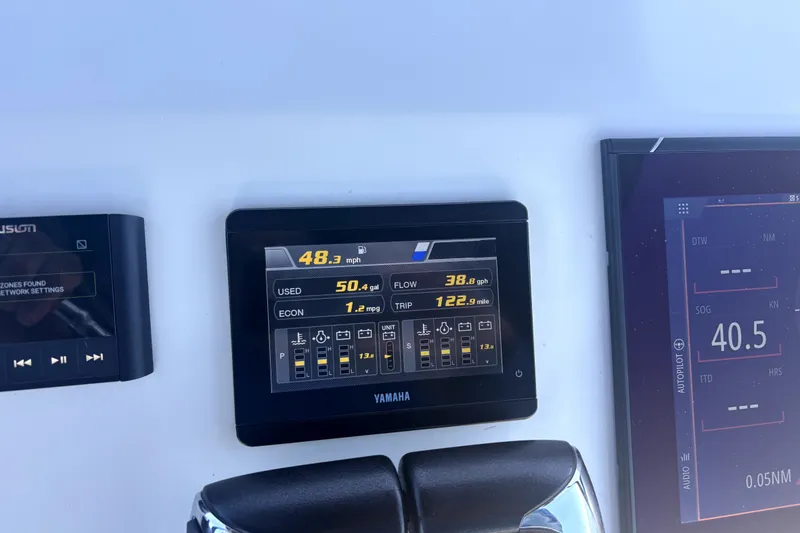 Slide: The Image of Dashboard of a 2021 Cortez 31 Super Panga displaying speed, fuel usage, and navigation data. - 34