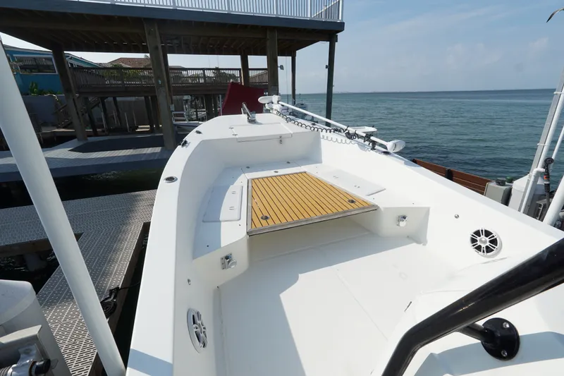 Slide: The Image of 2021 Cortez 31 Super Panga boat docked, featuring spacious deck and modern design. - 21