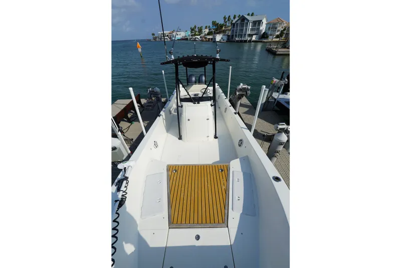 Slide: The Image of 2021 Cortez 31 Super Panga boat docked, featuring spacious deck and modern design. - 20