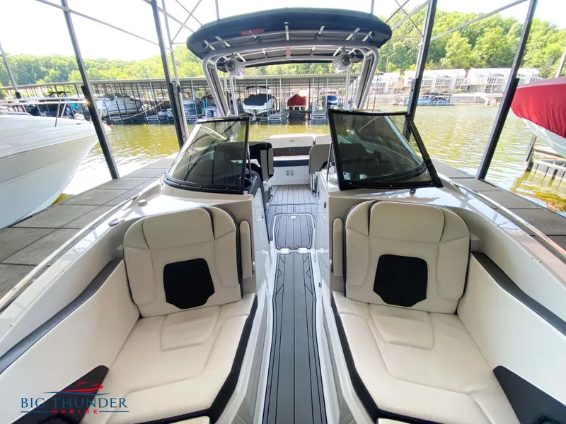 Slide: The Image of 2023 Monterey 298SS boat interior at dock with lake view. - 38